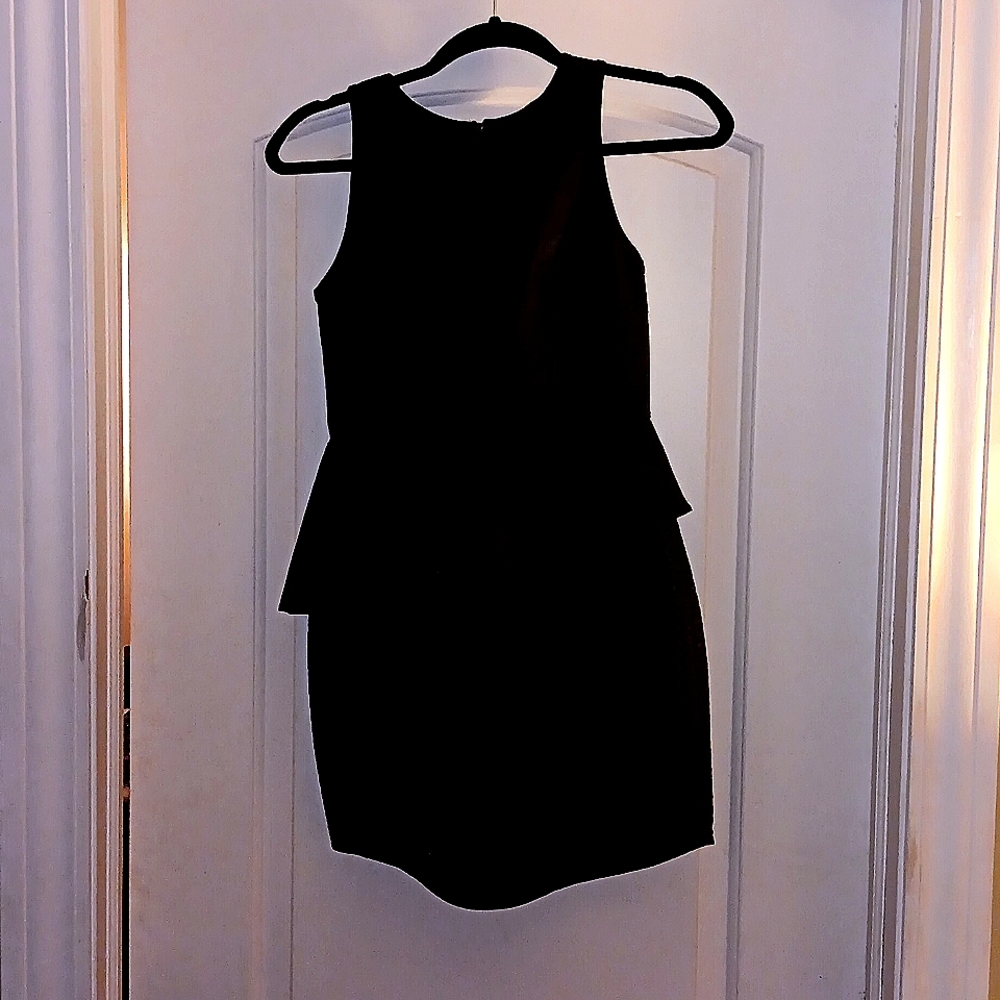 Black dress with a see-through front faux leather and a gold zipper in the back